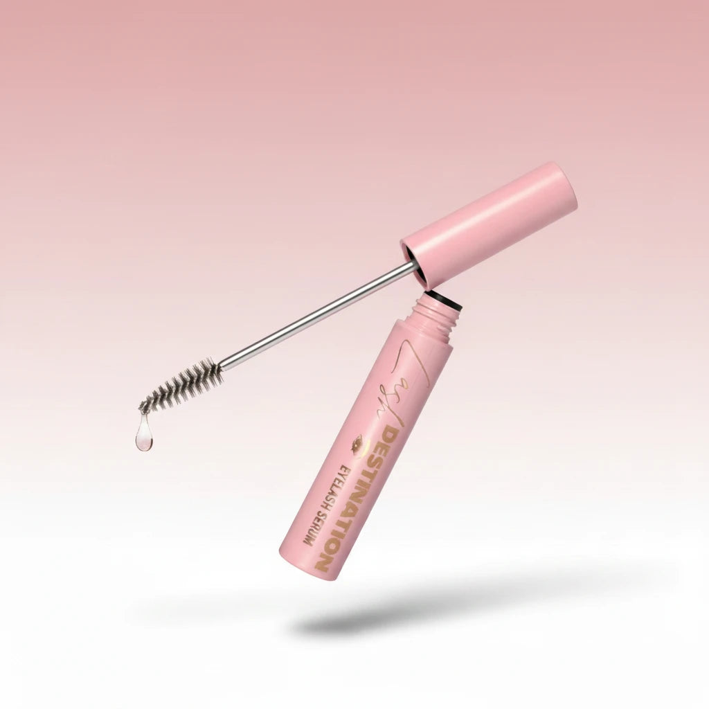 LashDestination eyelash serum in a light pink tube with a precision applicator brush and a clear nourishing formula.