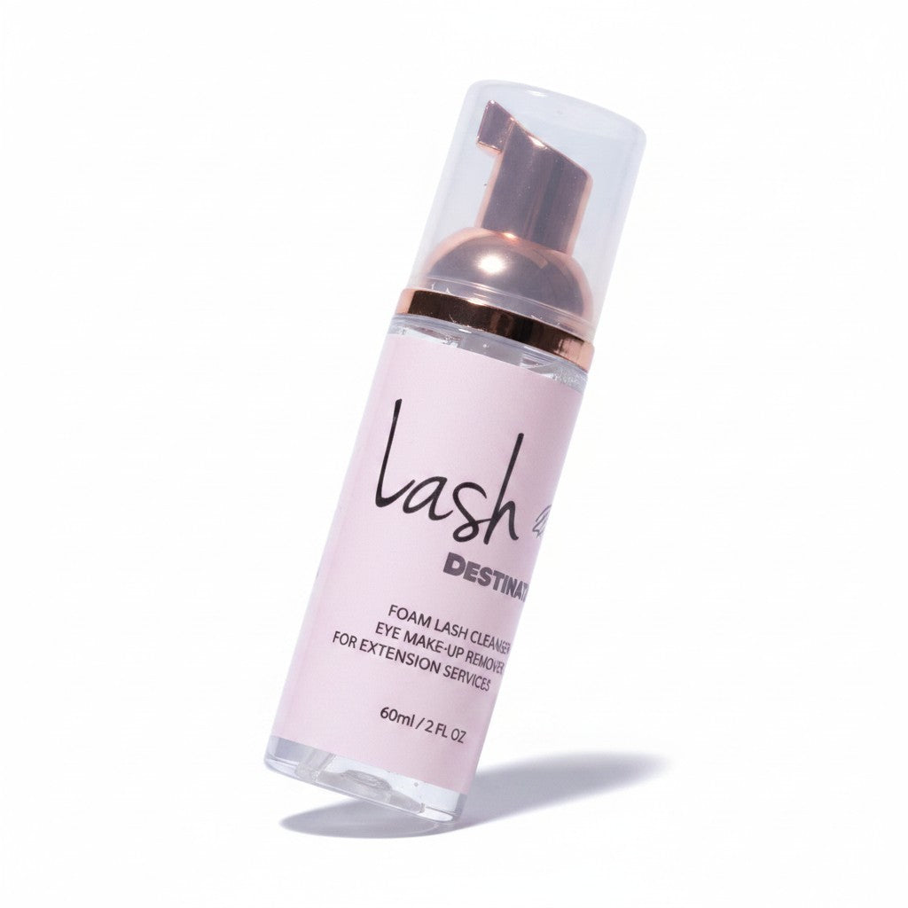 LashDestination gentle foam lash cleanser and makeup remover in a clear bottle with a rose gold pump dispenser.