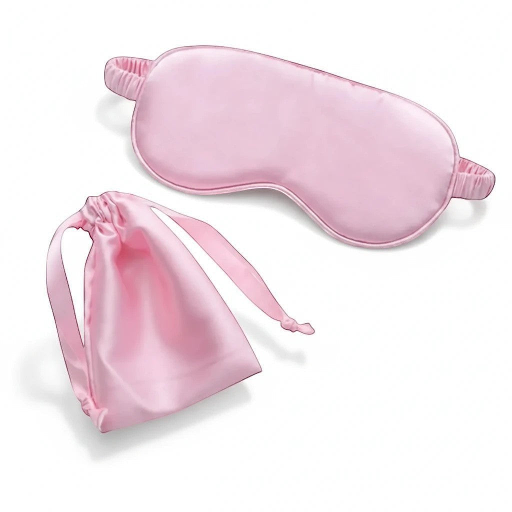 LashDestination soft pink satin sleep mask with matching drawstring travel pouch for comfortable rest.