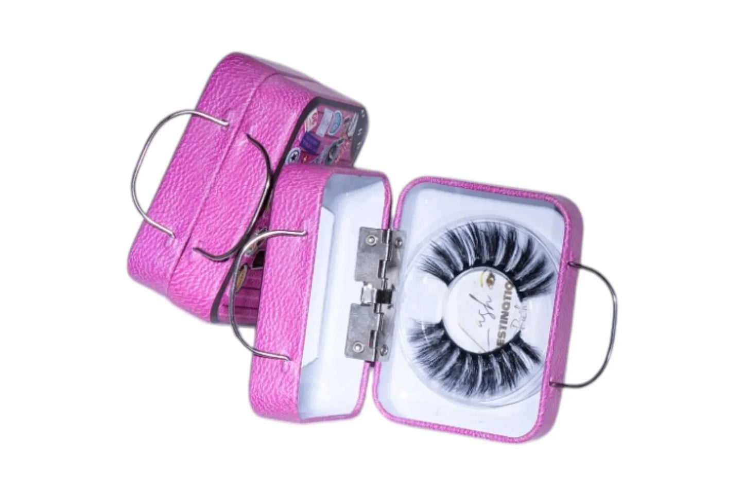 LashDestination pink miniature suitcase lash storage case with a pair of false eyelashes and a crown-shaped mirror.
