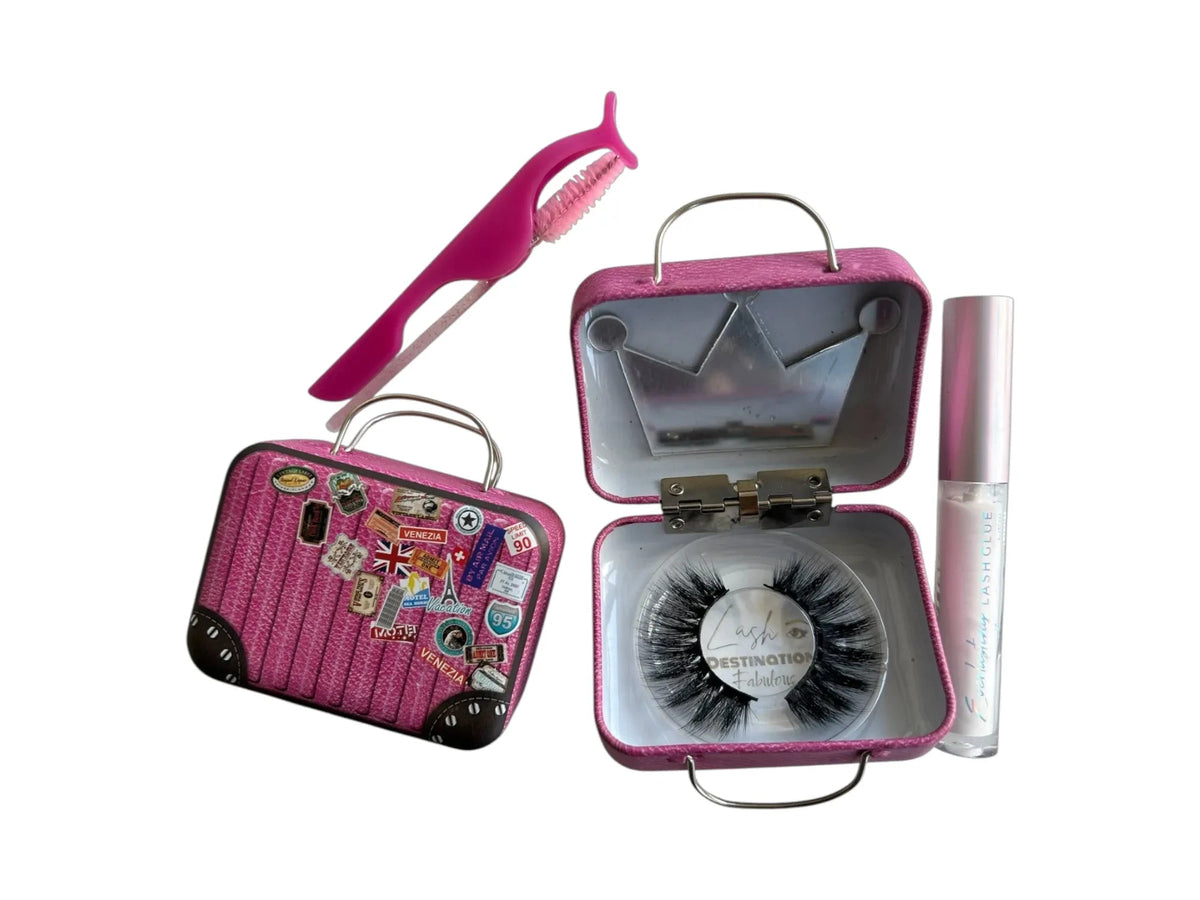 LashDestination pink suitcase lash storage case with crown mirror, false eyelashes, applicator tool, and lash glue.